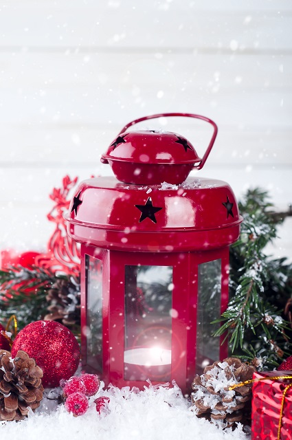 red lantern with snow background on white boards